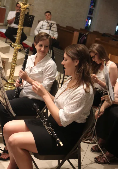 Photograph of two clarinet players preparing for a concert